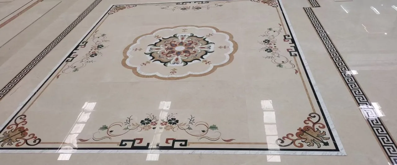 Decorative marble flooring laid out with waterjet inlay detailing
